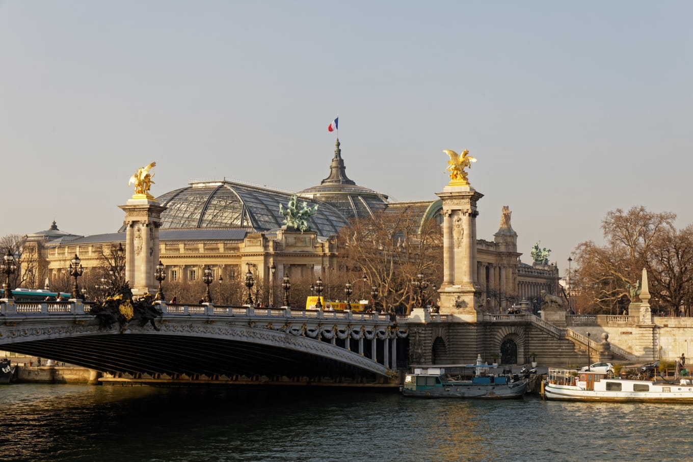 © thierry64 - The majestic glass roof of the Grand Palais and the Pont Alexandre III seen from the left bank of the Seine